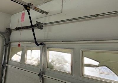 車庫　電動オーバードアシャッター　物を挟んだ　　パネル補修・開閉機交換